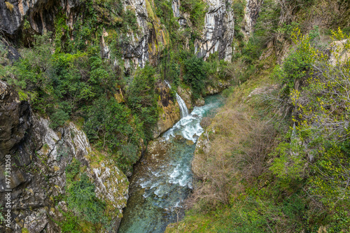 Fototapeta Naklejka Na Ścianę i Meble -  Famous hiking trail between mountains bordering the Cares river in Asturias Spain