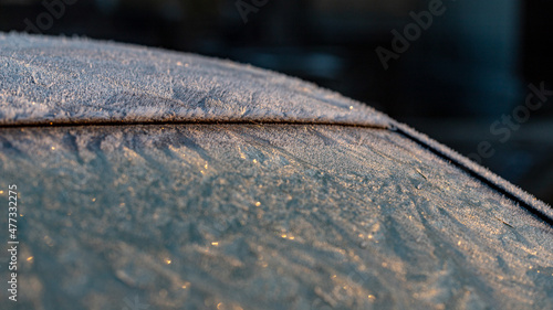 frost covered car window and roof