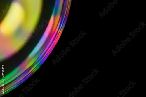 Multicolor psychedelic alien planet, with spectrum reflection, like from lens on dark background. Close-up soap bubble