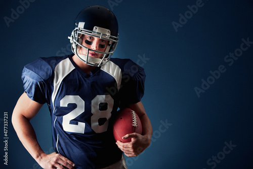 Football: Strong Player Holding Ball