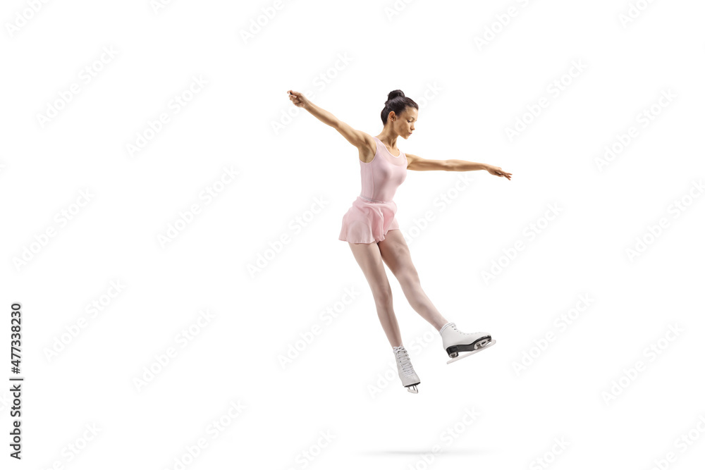 Full length shot of a professional female figure skater in a pink dress performing a jump
