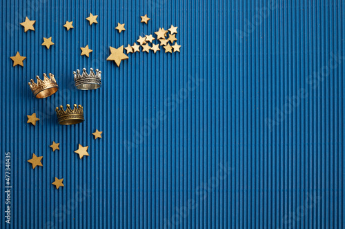 Fotografering Epiphany Day frame. 6 January. Three crowns on bue background