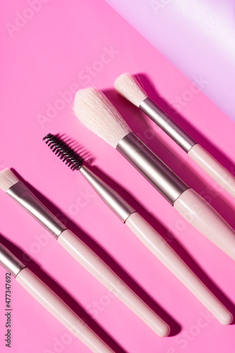 Makeup brush set on pink background. Set for makeup artist
