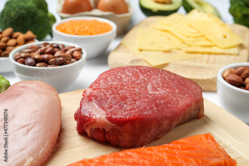 Fresh meat and other products on table, closeup. Sources of essential amino acids