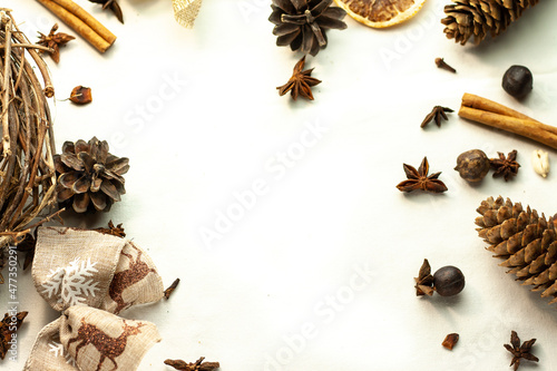 Christmas frame made of fir branches, cones, gold stars and decorations. Christmas wallpaper. background isolated on white. Flat lay, top view, copy