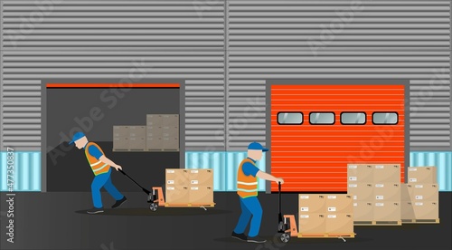 The work of the warehouse logistics complex. Loaders move pallets with boxes using hand pallet trucks. Storage equipment.