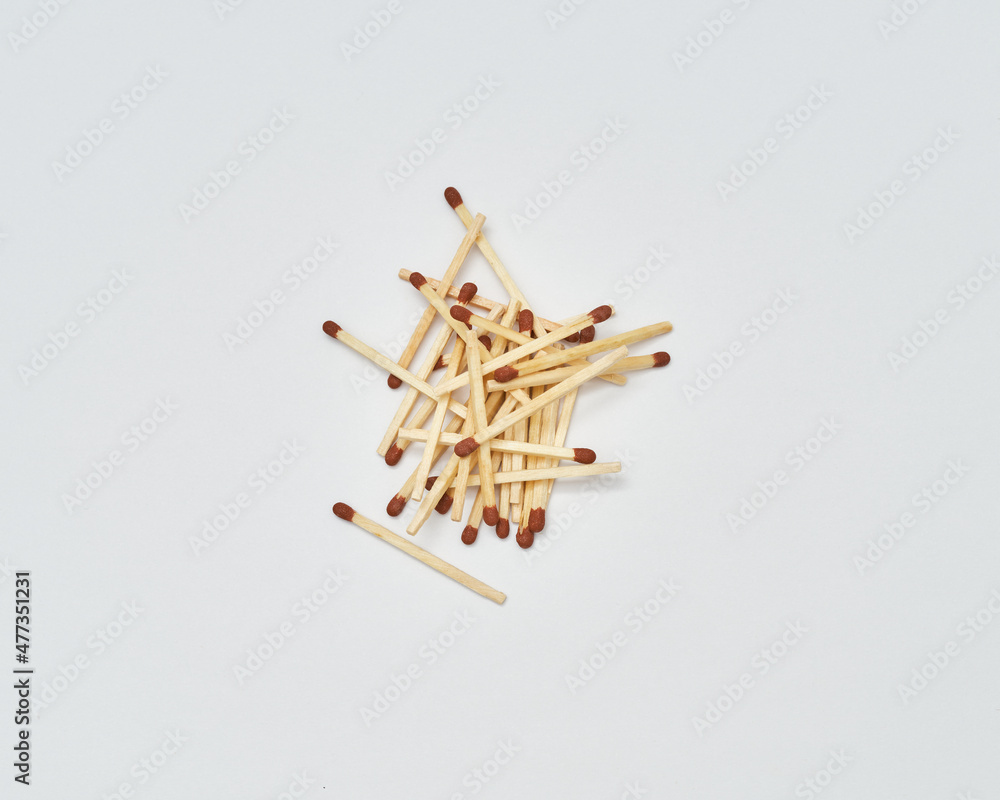 Piled up matches on white background Piled up matches on white background