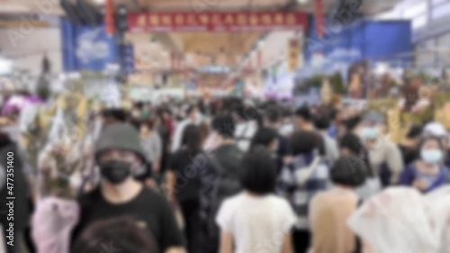 Wallpaper Mural Blurred defocused view of coronavirus 2019 nCov concept. People at street market shopping traditional decoration for Chinese new year celebration. Dangerous flu strain cases as pandemic. Torontodigital.ca