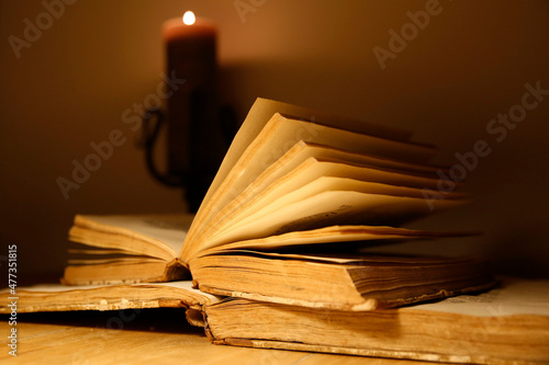 Close-up of the pages of an old book at night