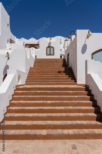 Detail of stairs and white wall of a house on the street of Egypt in Sharm El Sheikh © OlegD