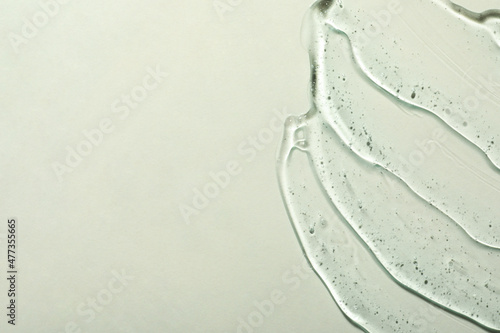 Cosmetic gel on light background, top view. Space for text
