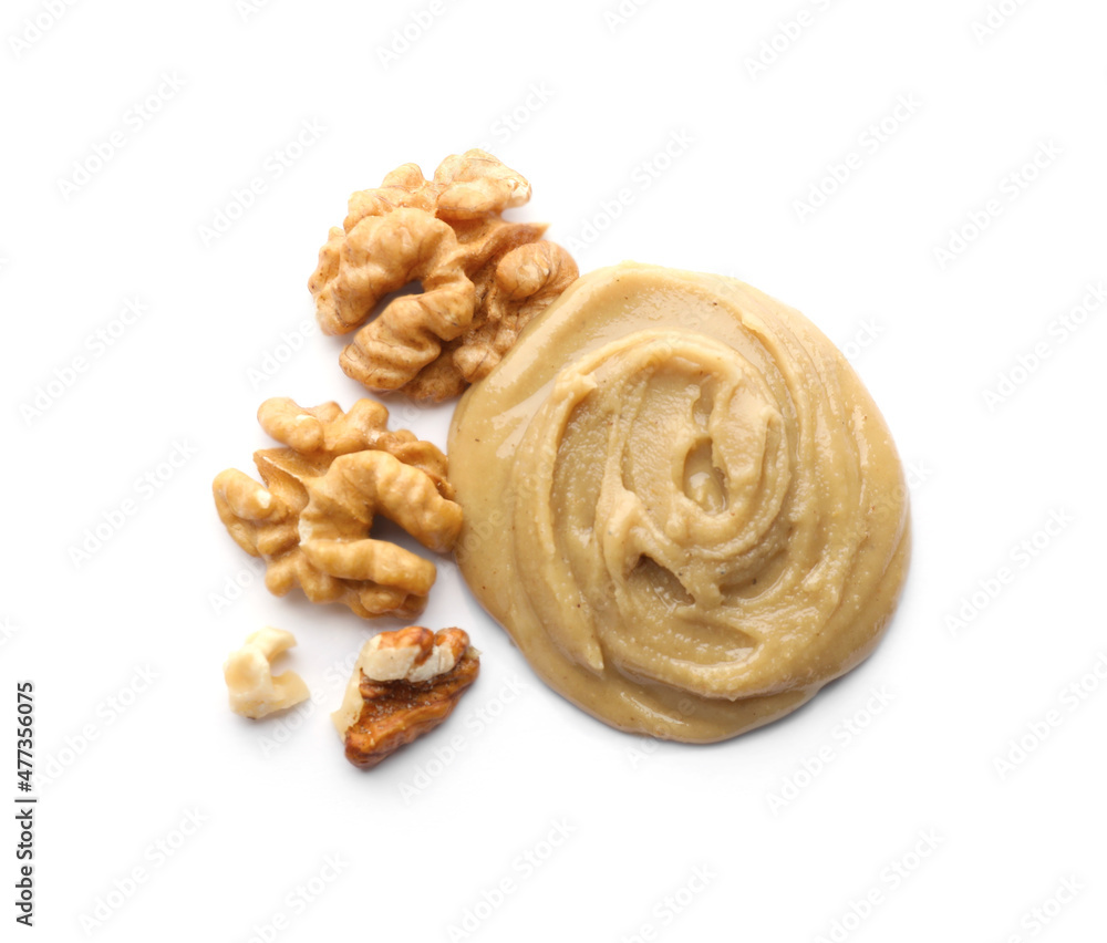Fototapeta premium Delicious walnut butter and nuts on white background, top view