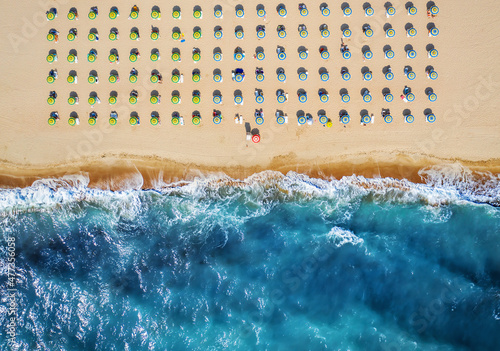 Canvas-taulu Top down view of beach with straw umbrellas
