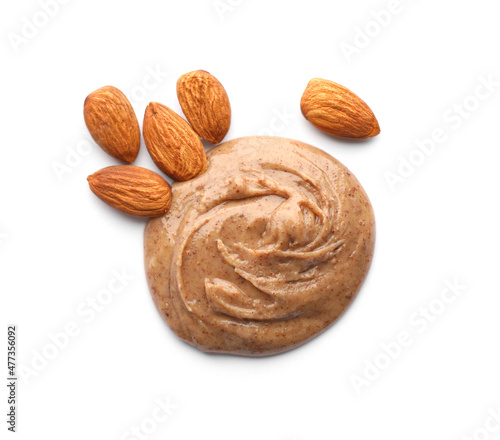 Delicious almond butter and nuts on white background, top view photo