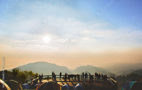 Perspective beautiful moutain view with crowded silhouette people at Doi Ang Khang - Chaing mai ,Thailand photo