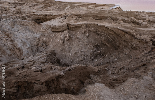 Fototapeta View of Dead Sea sinkholes (or swallows), a deep hole in the ground formed abruptly along the coastline of the Dead Sea, Ein Gedi, Israel