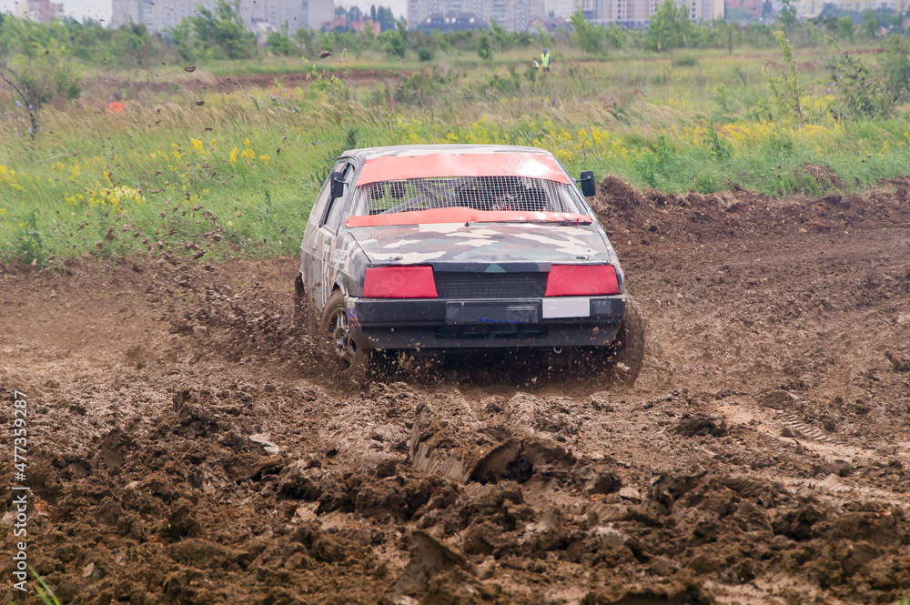 rally car rides on mud