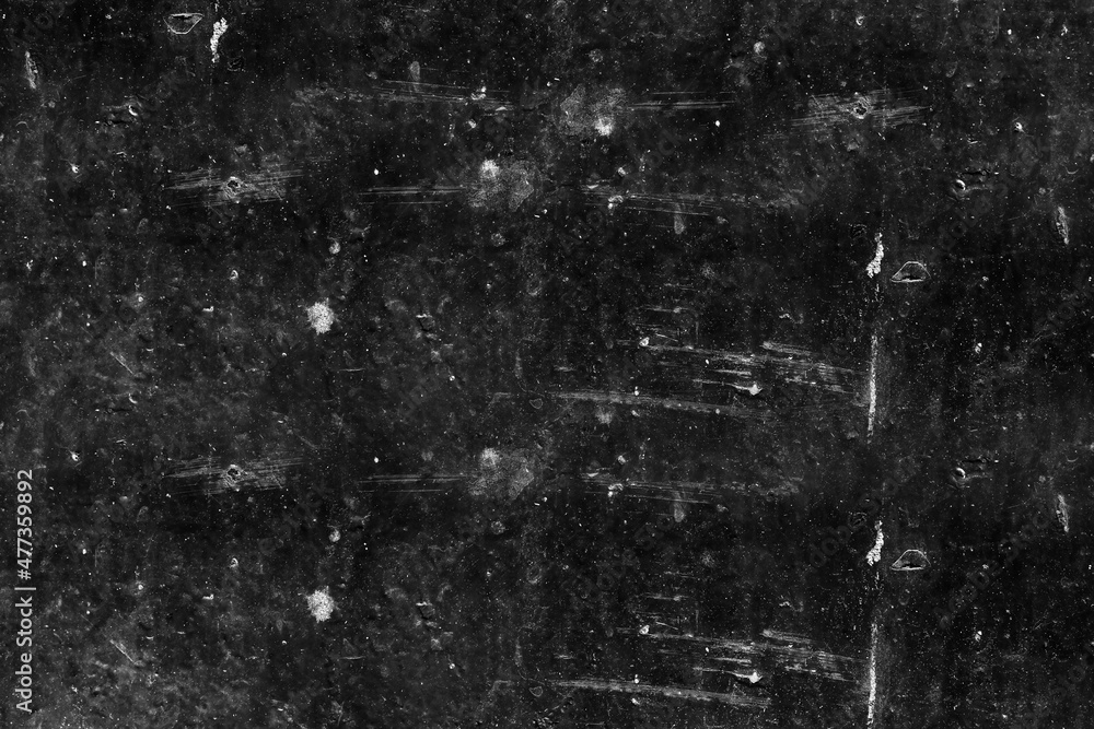 Abandoned black metal sheet with scratches and spots for texture background