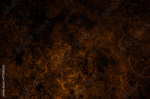 Rough grunge texture background of shiny brown color cement plaster wall