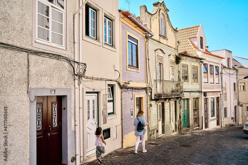 Colorful houses and narrow streets in the fishing village of Costa Nova Colorful houses and narrow streets in the fishing village of Costa Nova