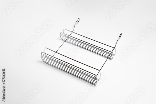 Fototapeta Naklejka Na Ścianę i Meble -  Stainless steel cutlery and dish drainer isolated on white background. High-resolution photo.