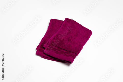 Folded soft towel isolated on white background.High resolution photo.Top view. Mock-up.