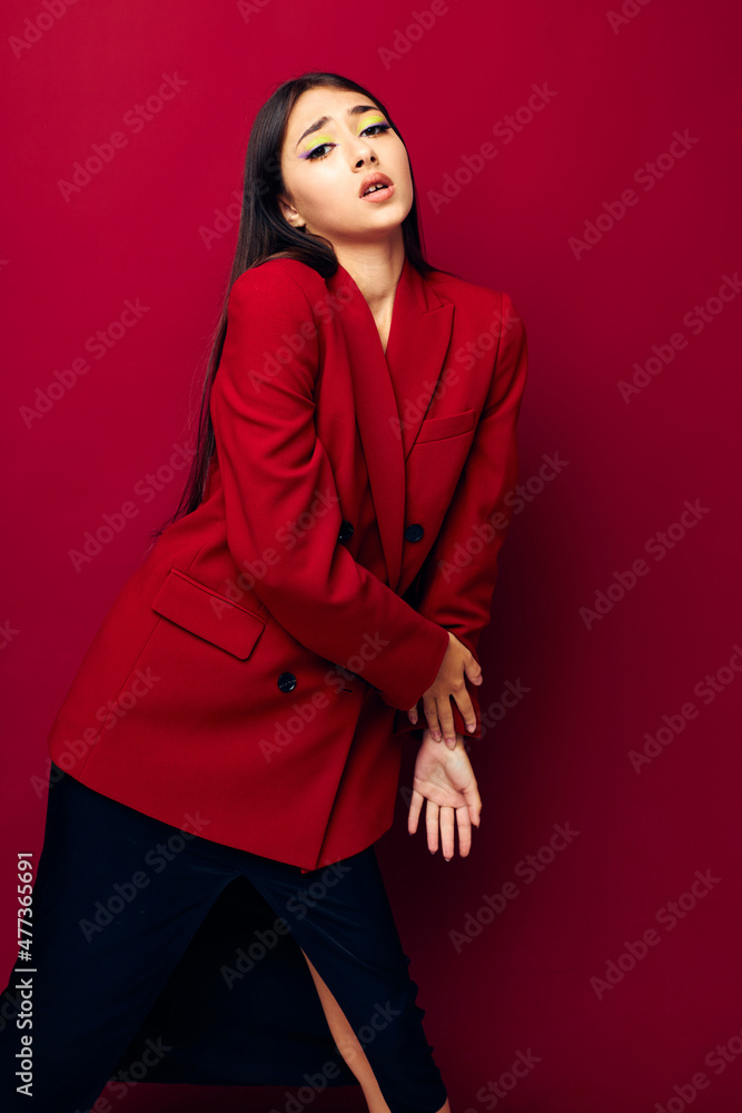 young woman fashion posing in red jacket red background unaltered young woman fashion posing in red jacket red background unaltered