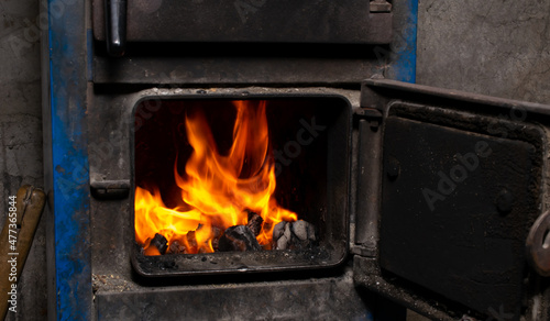 burning coal in a central heating furnace