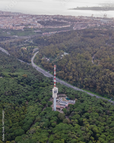 Lisbon, Portugal - February 2021: Aerial view of Altice tower, a communication tower in Monsanto hill and park, Lisbon, Portugal. photo