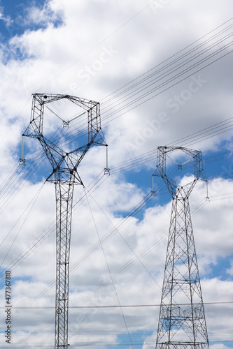 Wallpaper Mural A power transmission high voltage tower in countryside  isolated on sunset with some nice warm clouds in the sky. Torontodigital.ca