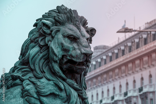 lion statue in front of the palace