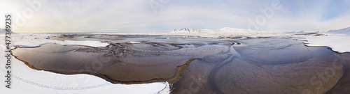 Aerial panoramic view of estuary Leirarvogur and mountains in winter with snow, western Iceland. photo