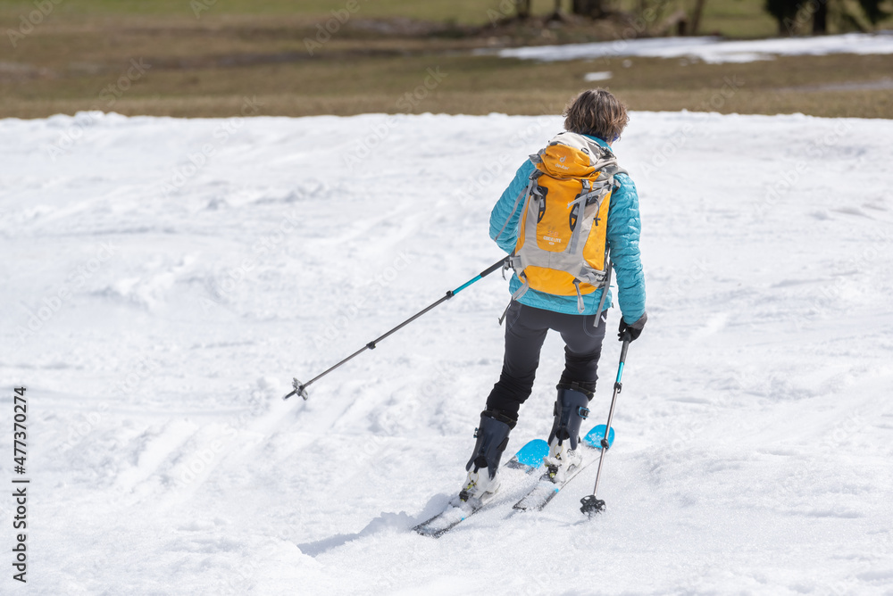 Skier descending the mountain in winter