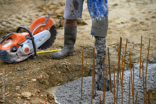 Worker on a construction site working with concrete