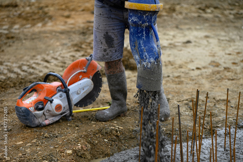 Worker on a construction site working with concrete