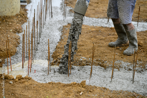 Worker on a construction site working with concrete