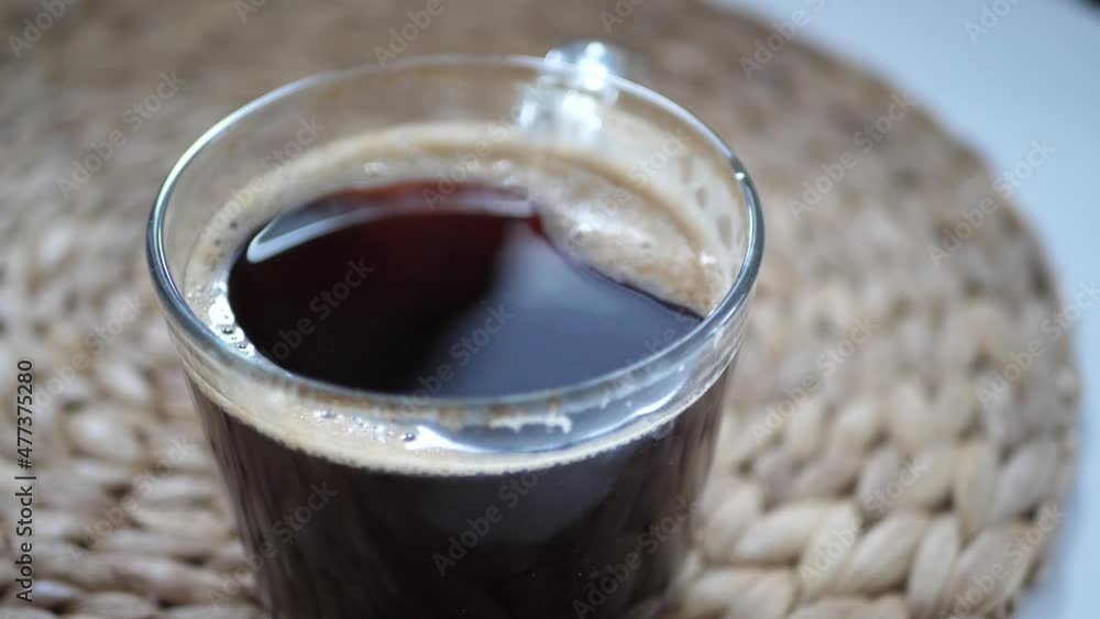 Cup of coffee standing on a table at home Cup of coffee standing on a table at home