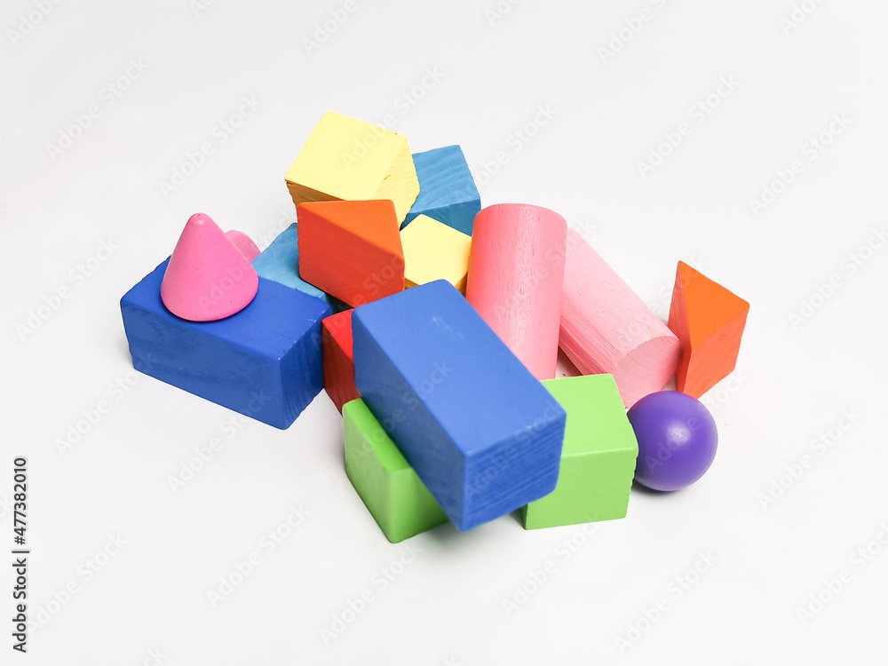 Obraz premium Education concept. Abstract colorful wooden geometric shape against white background.