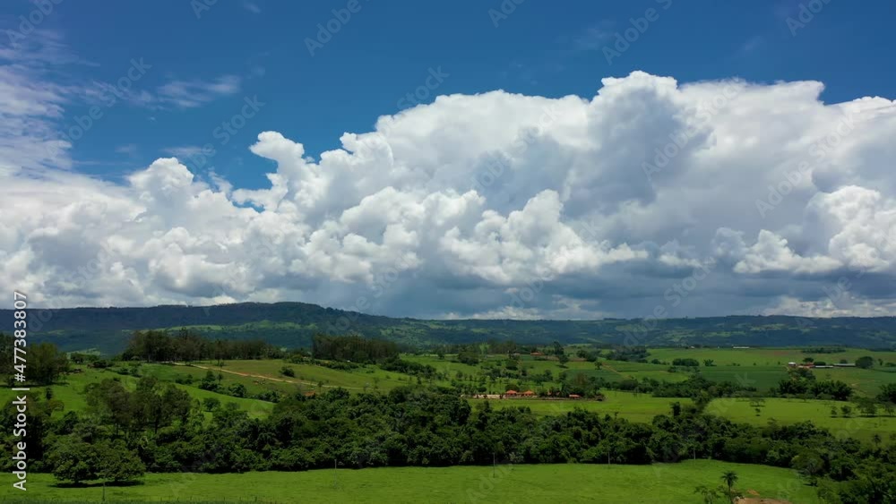 Farming landscape at countryside rural scenery. Green field background at valley mountains. Farming landscape at countryside rural scenery. Green field background at valley mountains.