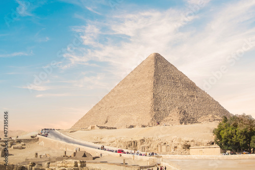 Great Sphinx against the background of the pyramids of the pharaohs Cheops  Khafren  and Mikerin in Giza  Egypt