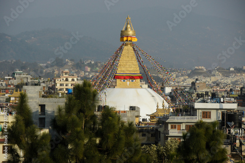 Boudhanath Tibetan Buddhist stupa with colorful prayer flags flying, Kathmandu, Nepal
