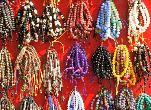 Fototapeta Tibetan Buddhist prayer beads for sale in shop at Boudhanath, Kathmandu Valley,