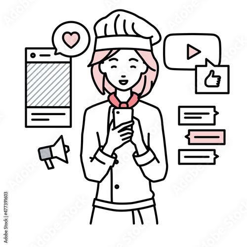 立ってスマートフォンでさまざまなSNSで楽しく交流する調理師の女性