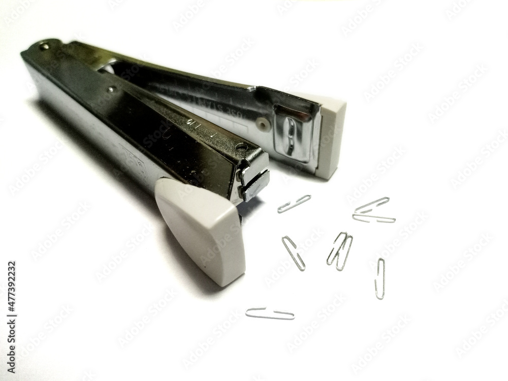 Stapler and staples on a white background. Stapler and staples on a white background.