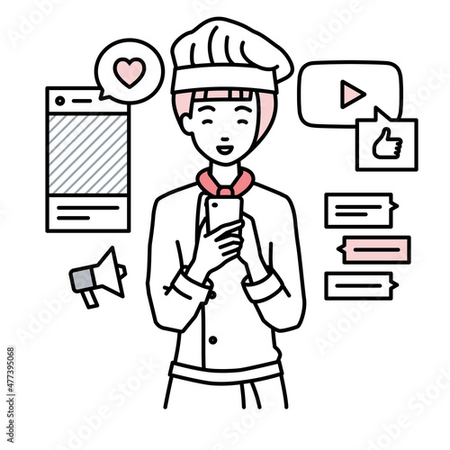 立ってスマートフォンでさまざまなSNSで楽しく交流する調理師の女性