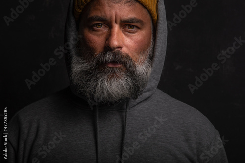 Wallpaper Mural Portrait of middle aged man with gray hoodie with gloomy expression against Torontodigital.ca