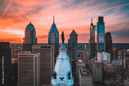William Penn statue in Pennsylvania city skyline in Philadelphia, US under sunset sky photo