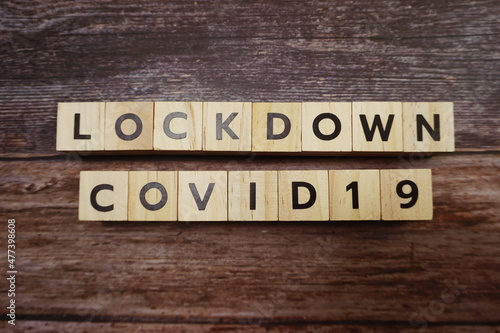 Lockdown Covid19 alphabet letters on wooden background
