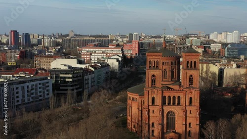 Aerial of St Thomas Church in Kreuzberg with the city skyline of Berlin photo