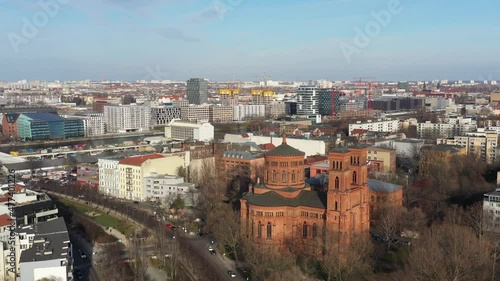 Aerial of St Thomas Church in Kreuzberg with the city skyline of Berlin photo